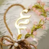 Detailed shot of the white paper daisy and double jute and pink ribbon bow