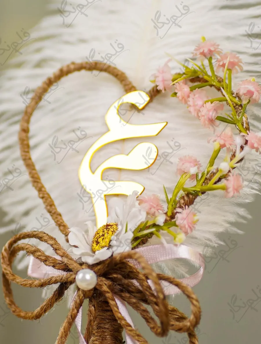 Detailed shot of the white paper daisy and double jute and pink ribbon bow