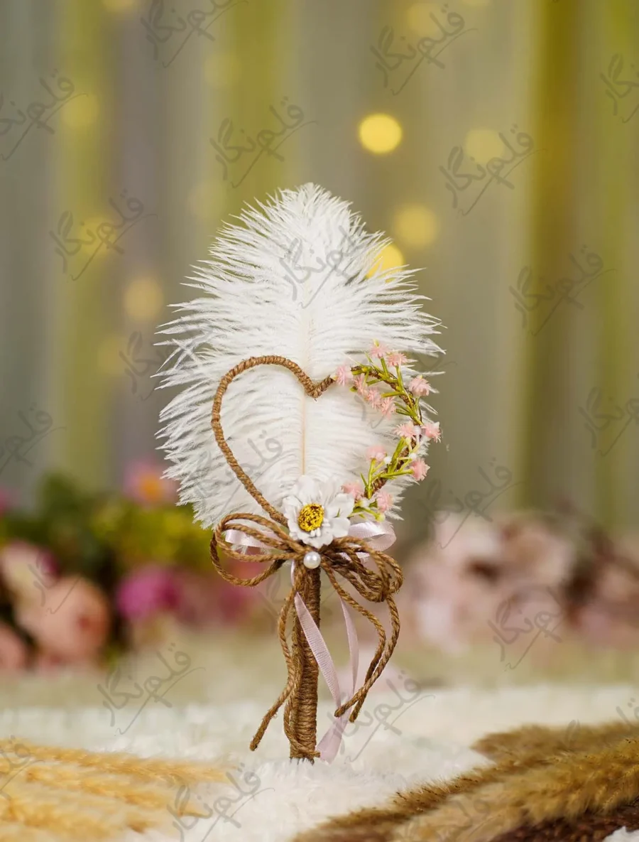Handmade white feather Nikkah pen with a jute heart and pink flowers