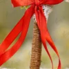 Detailed shot of the red satin ribbon bow, white lace backing, and jute wrapping