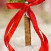 Close up of the golden monogram cutout suspended in the middle of the heart
