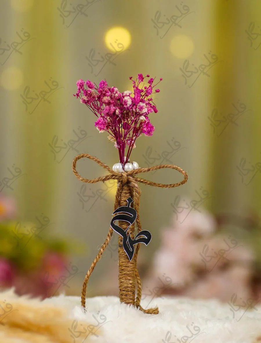 Close up of the black mirror acrylic Qabool Hai calligraphy hanging from the jute wrap