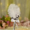 Handmade white feather Nikkah pen with a silver handle and gold spiral