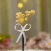 Silver metal Nikkah pen with dried cream baby's breath flowers and white ribbon