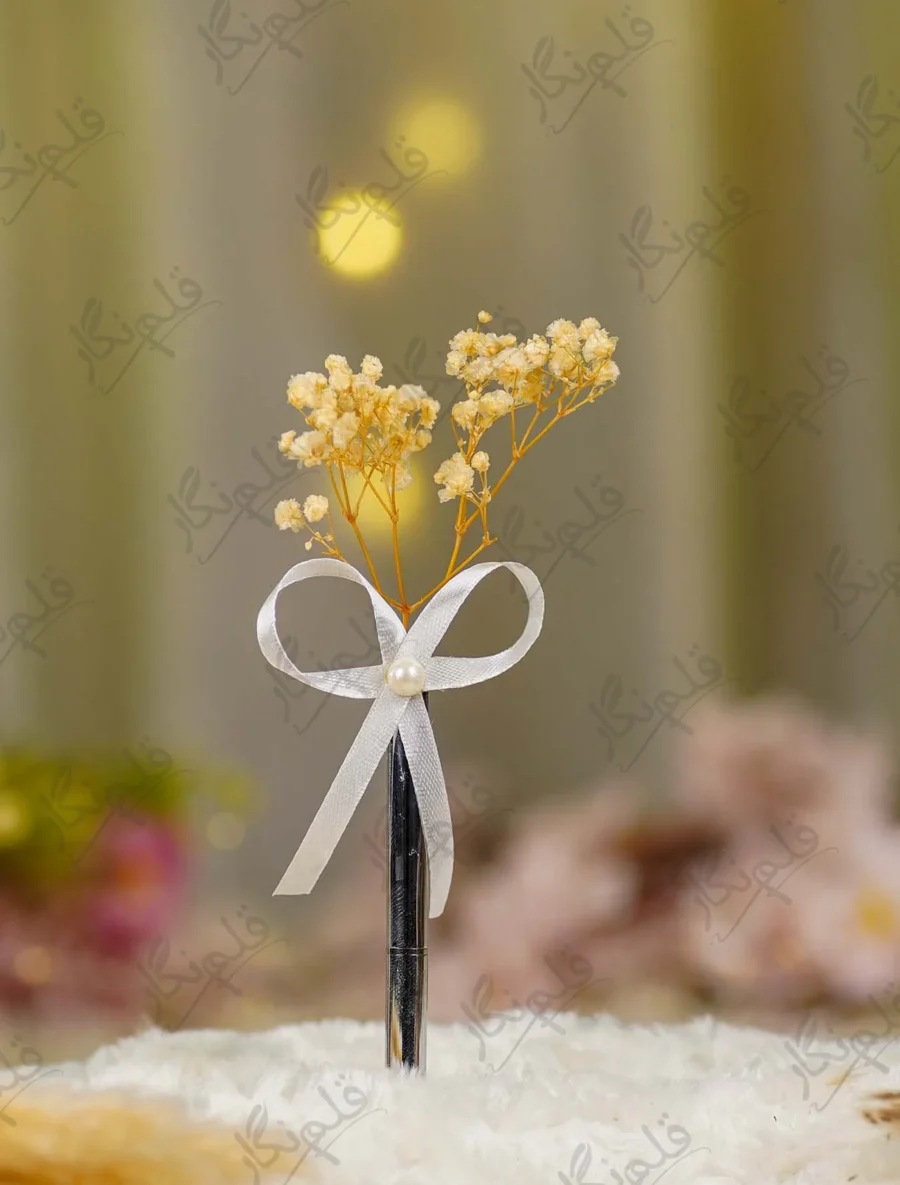 Silver metal Nikkah pen with dried cream baby's breath flowers and white ribbon
