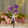 Silver metal Nikkah pen with dried purple baby's breath flowers and white ribbon