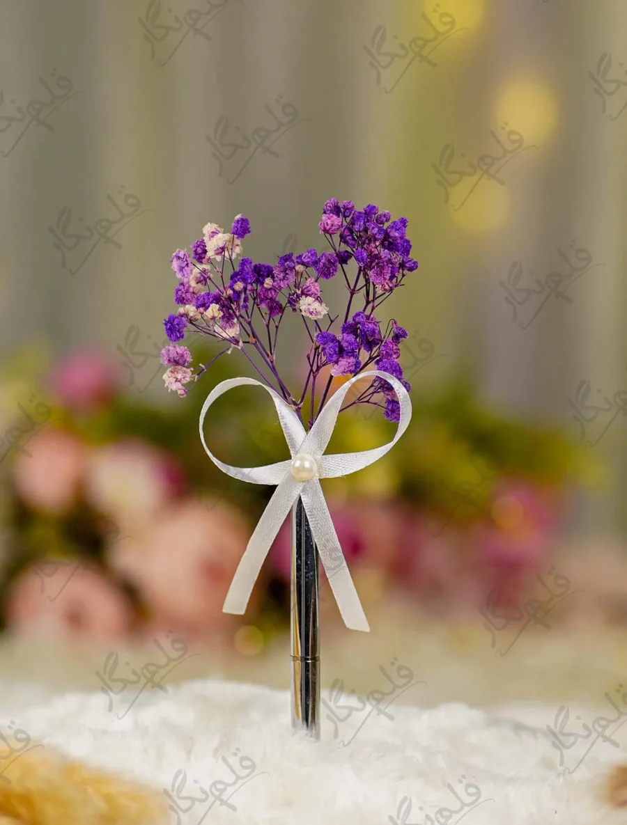 Silver metal Nikkah pen with dried purple baby's breath flowers and white ribbon