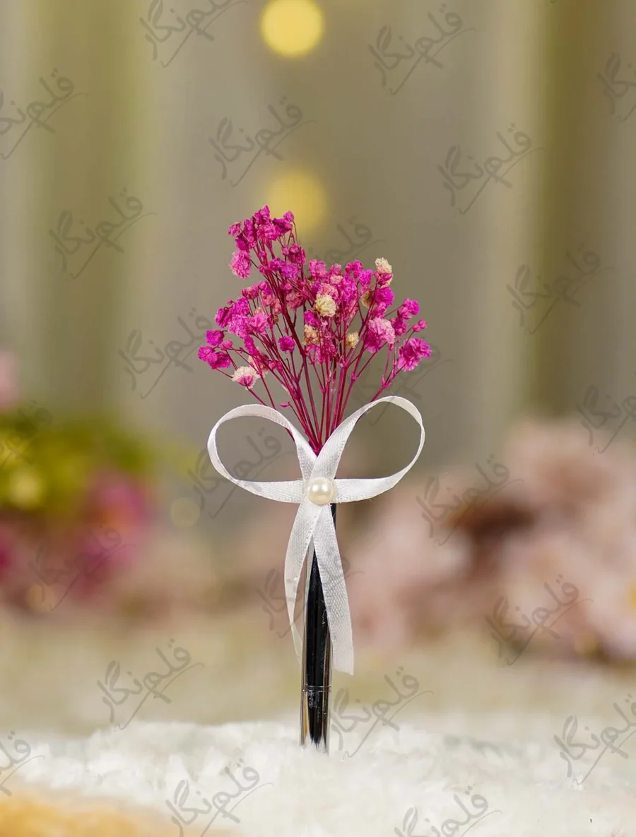 Silver metal Nikkah pen with dried pink baby's breath flowers and white ribbon