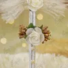 Detailed close up of the mid-handle white rose and gold stamen embellishments