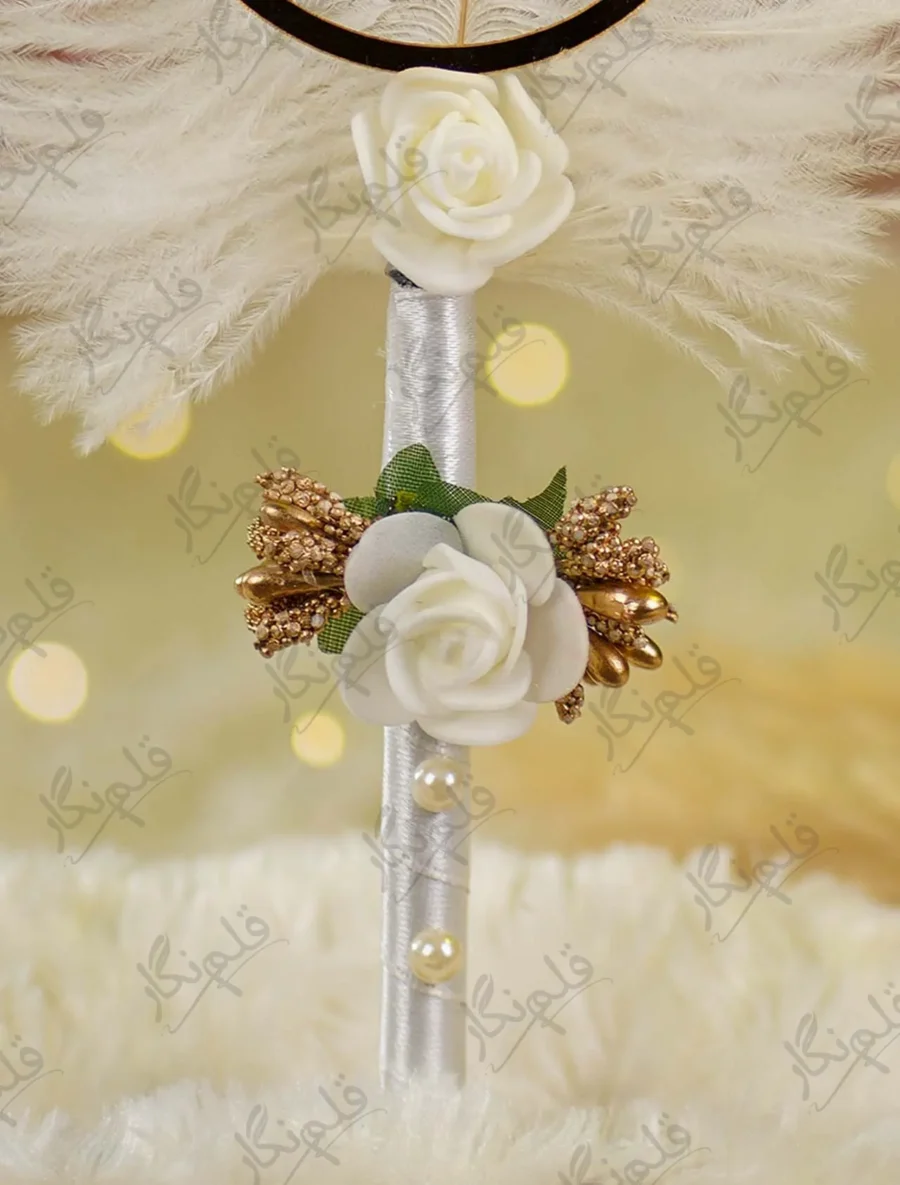 Detailed close up of the mid-handle white rose and gold stamen embellishments