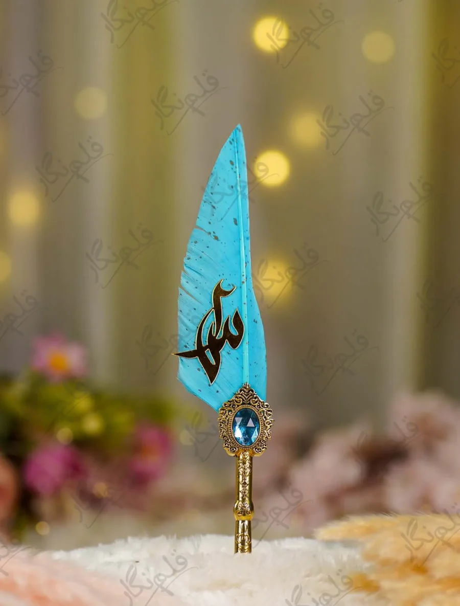 Detailed close up of the gold splatters on the teal quill feather