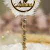 Elegant gold themed wedding signing pen lying on a soft white fur backdrop