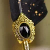 Ornate gold metal handle showing detailed scrollwork