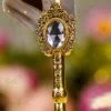 Close up of the natural grey quill feather with gold dust flecks