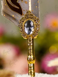 Close up of the natural grey quill feather with gold dust flecks