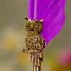 Upper half of the royal purple quill feather showing fine details