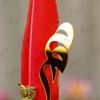 Upper half of the natural red quill feather showing fine fibers