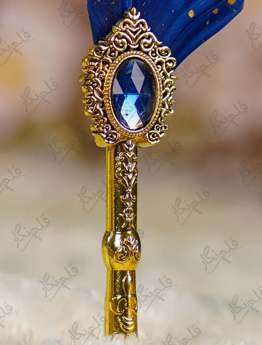 Side angle view of the blue feather showing gold paint spots