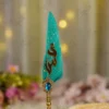 Ornate gold metal handle showing detailed scrollwork