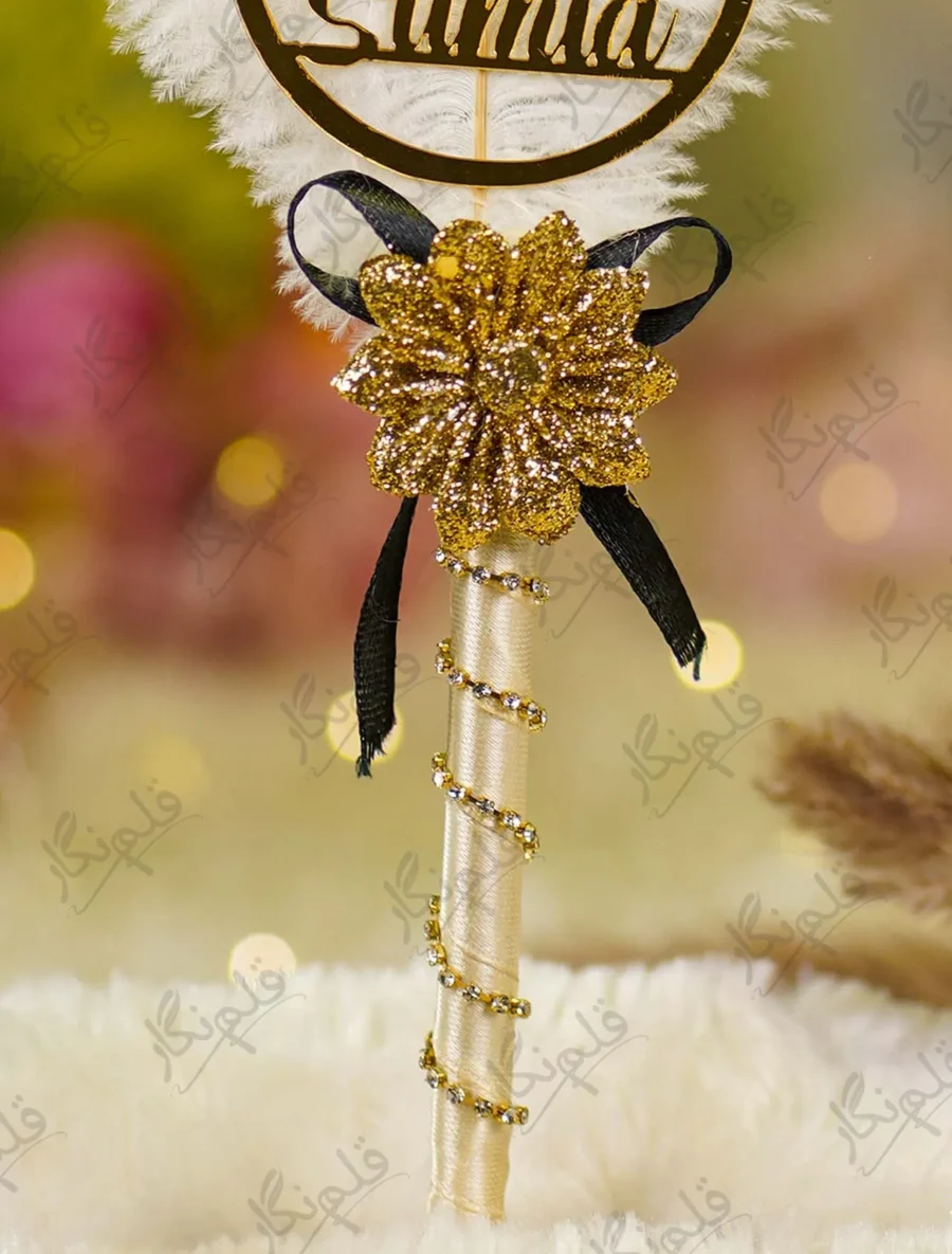Customized version showing circular gold acrylic couple name circle on the feather