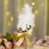 Handmade white feather Nikkah pen with a gold satin bow and golden lace wrap