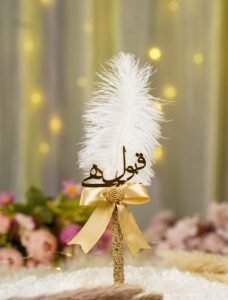 Handmade white feather Nikkah pen with a gold satin bow and golden lace wrap