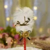 Handmade white feather Nikkah pen with a red handle and black bow