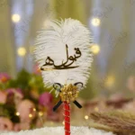 Handmade white feather Nikkah pen with a red handle and black bow