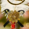 Detailed close up of the red satin handle with gold rhinestone spiral